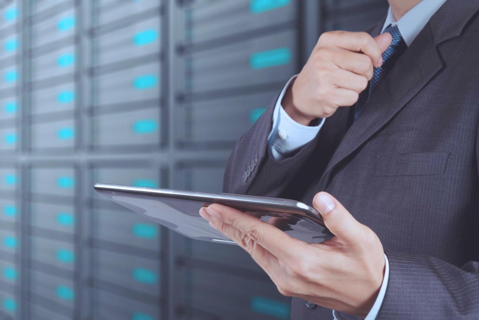 Game development team reviewing code and testing mobile game build