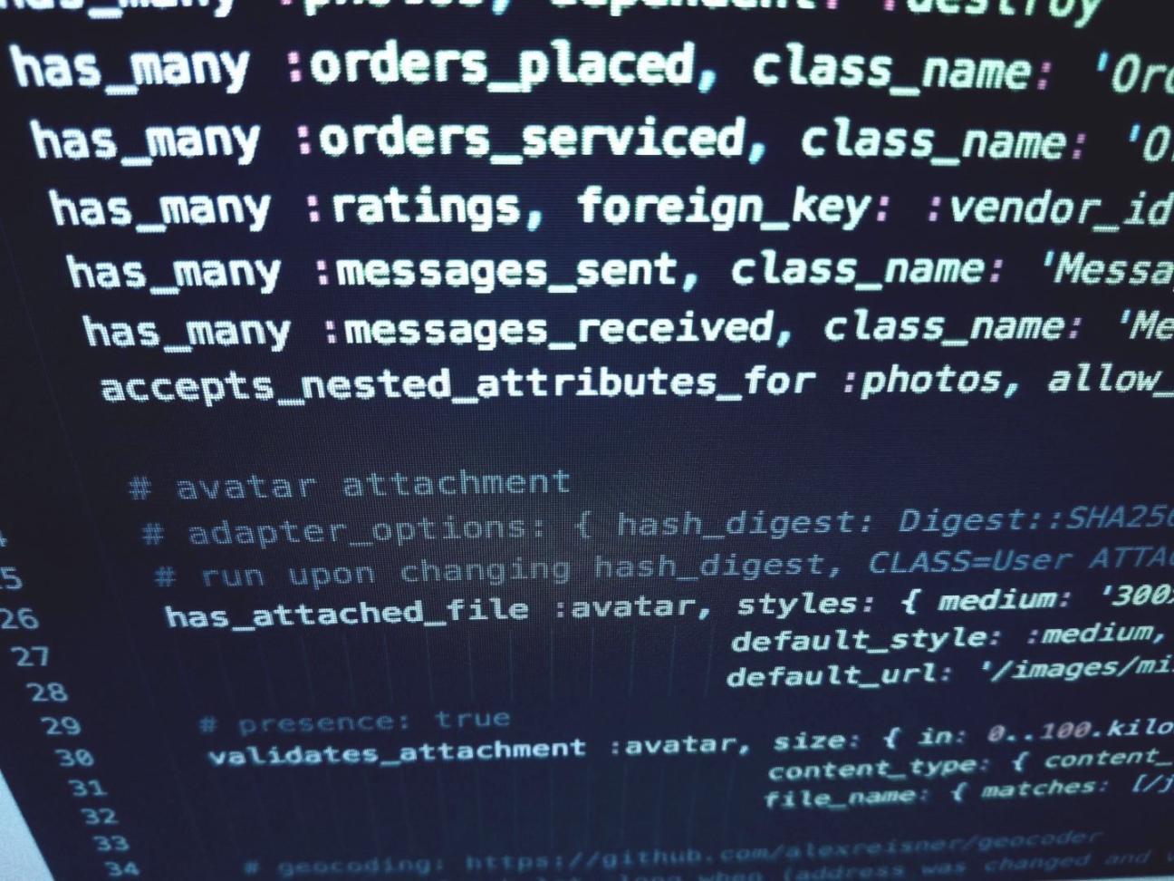 Development workspace with multiple test devices and collaborative planning materials